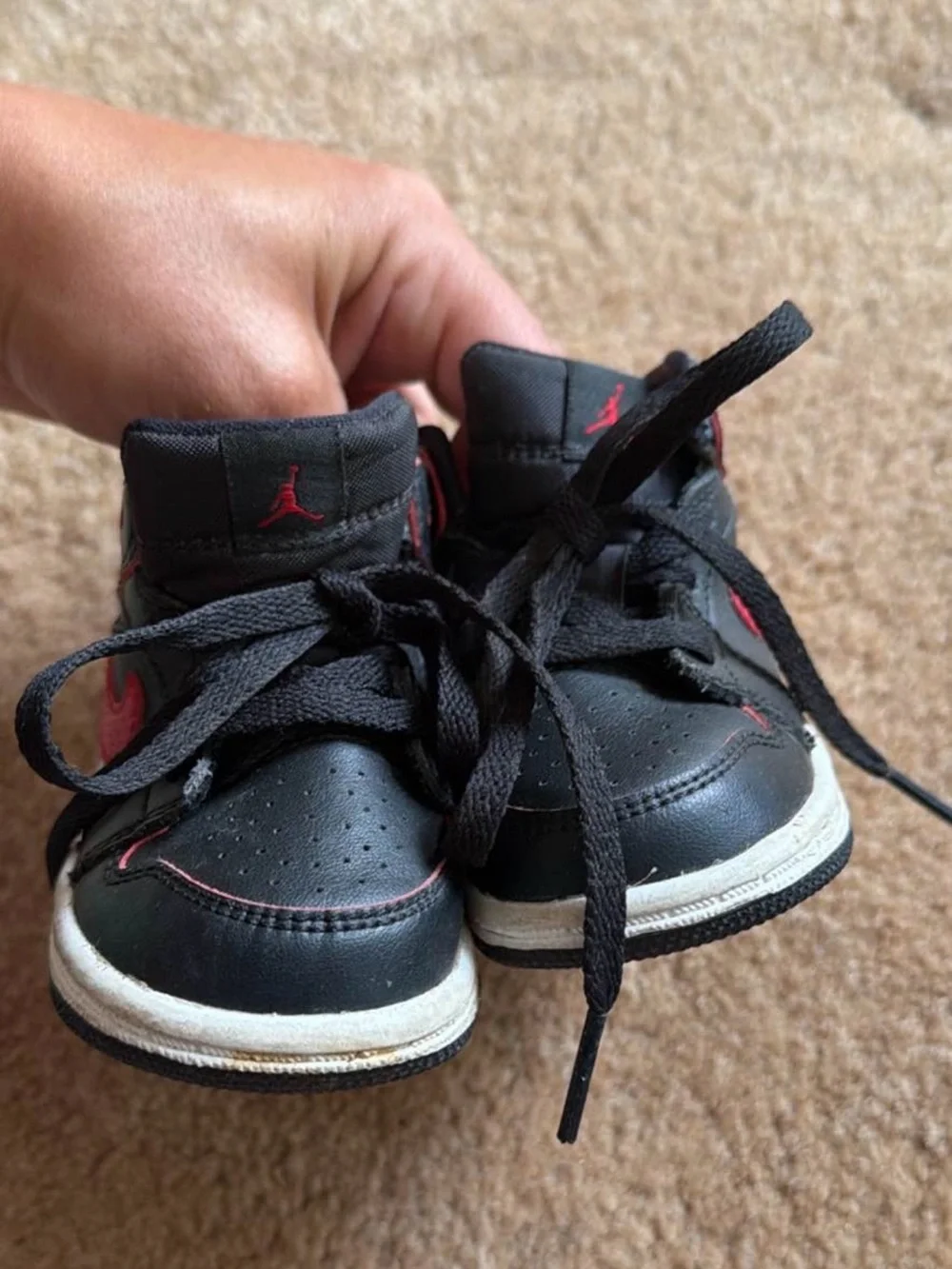Nike Kids Black Sneakers with Red Swoosh